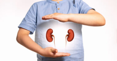 Illustration of a child holding their hands around two kidneys.
