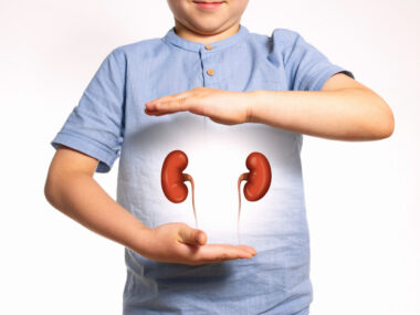 Illustration of a child holding their hands around two kidneys.
